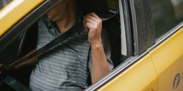 cab ride, going on a cab, wearing seat belt on a cab ride