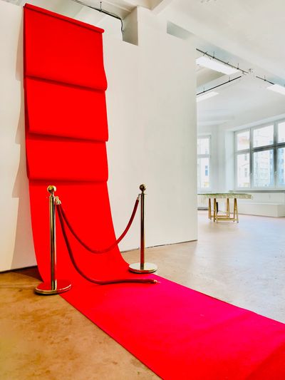 Anwar Al Atrash, Red Carpet II, 2022, dimensions variable, carpet, bell metal bollards