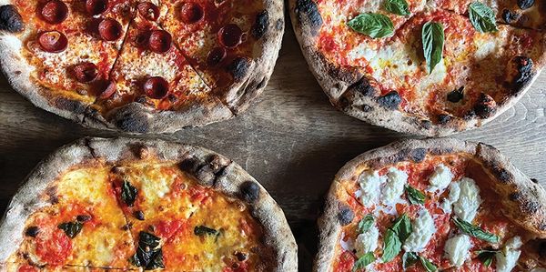 Four Neapolitan pizzas pictured together from Cane Rosso.