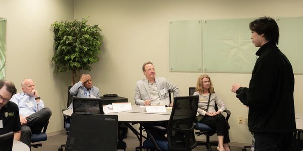 Chris Dahlander listening to a presentation to understand the business and what is needed.