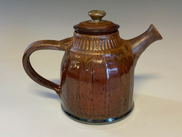 Teapot, ketchup red glaze. $120