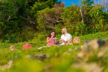 Couple having a sunset aperitif on the UNESCO World Heritage Site  - Le Morne Brabant Mauritius
