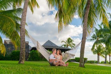 Sunset Family Photoshoot posing on a hammock at LUX* Le Morne Mauritius