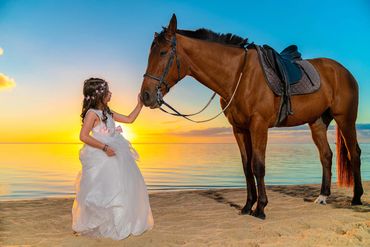 Cute little girl in white wedding dress with a horse during sunset - Mauritius_Photographer