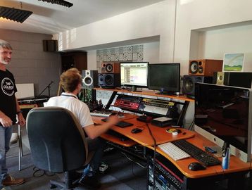 Image of two TMP College tutors working in the Recording Studio at the Pemberton campus. 