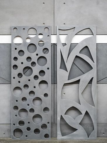 laser cut aluminum masrabiya pattern standing with wall