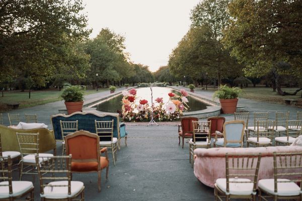 wedding ceremony with mismatched chairs at The Horticulture Center Philly
