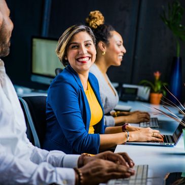Coworkers share a moment of joy at the office
