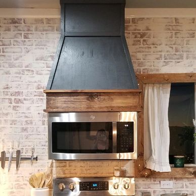 Custom range hood built over microwave