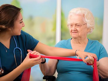 Senior woman using resistance bands.