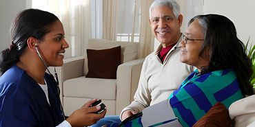 Nurse visiting couple at home.