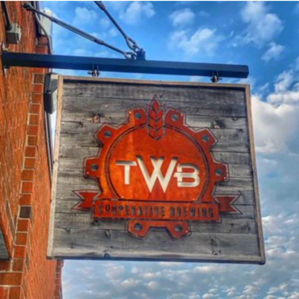 Wooden sign for TWB Cooperative Brewing.