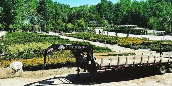 Flatbed trailer at a plant nursery.
