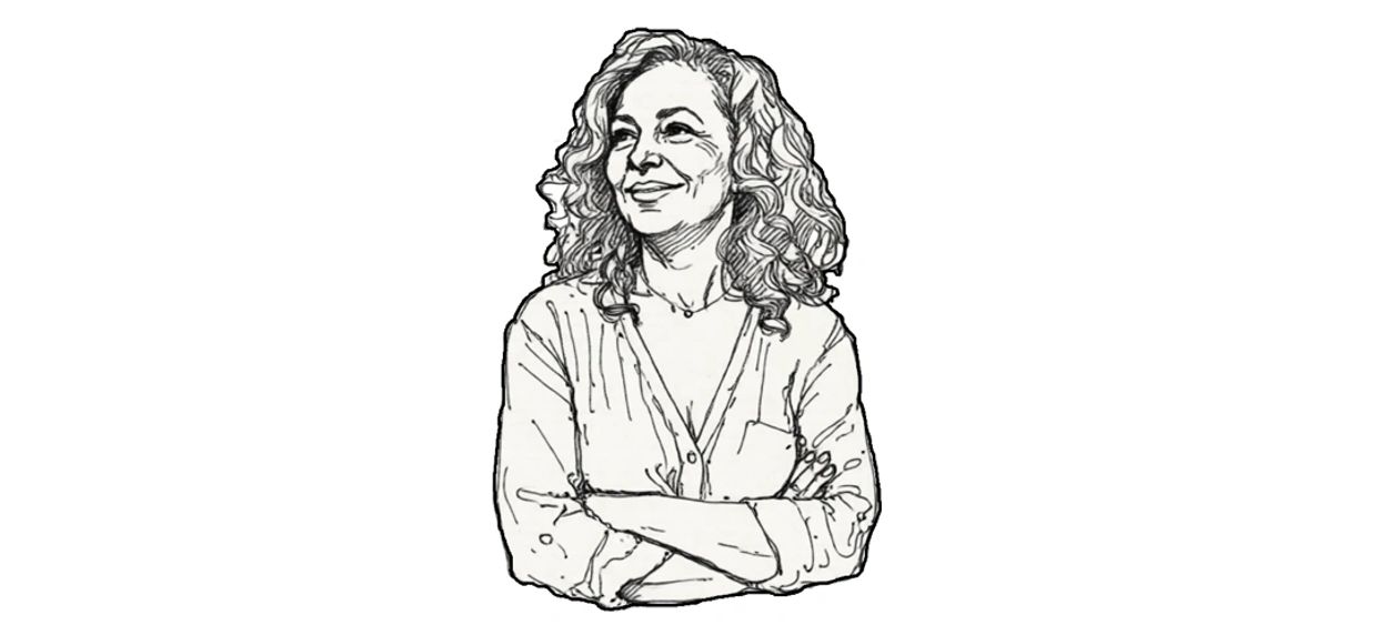 Picture of a confident middle-aged woman crossing her arms and smiling.