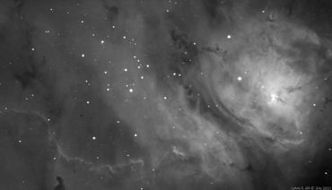 Bok globules of dark collapsing protostellar clouds are seen, The Hourglass Nebula is illuminated by