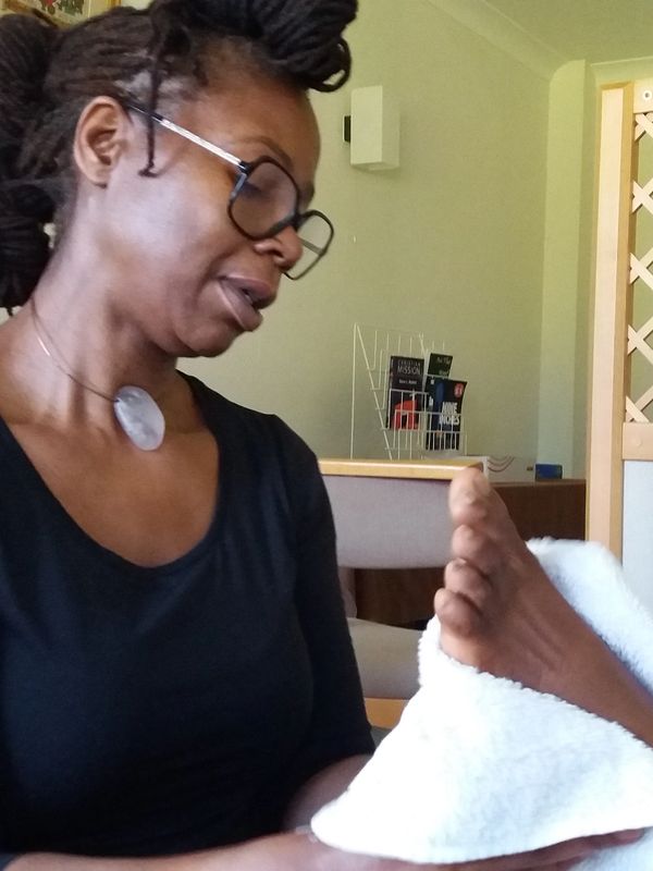 Catherine practicing reflexology in her studio