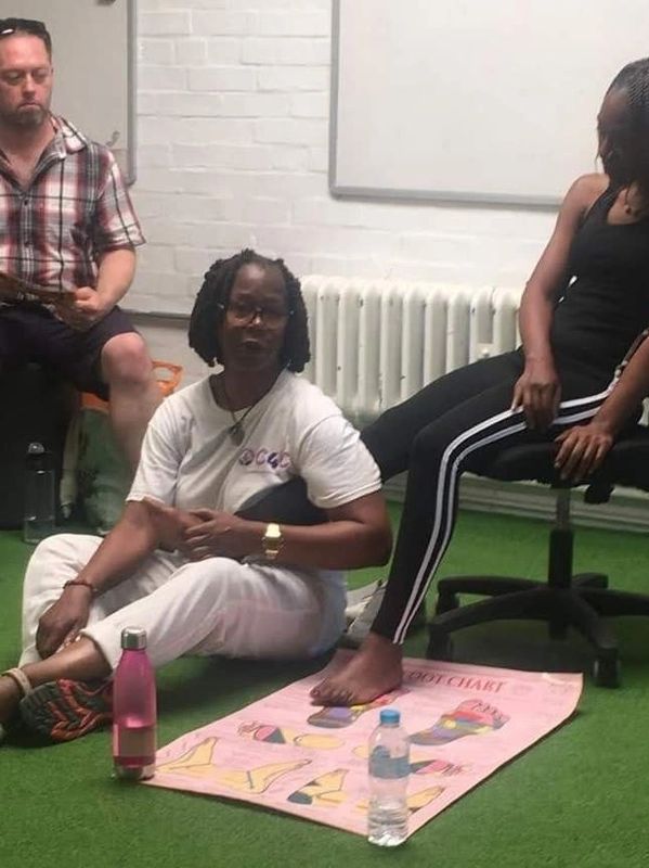 Catherine doing reflexology with one of her clients