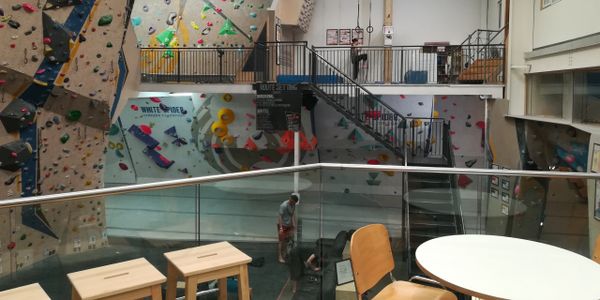Mezzanine floors for climbing, viewing, cafeteria and office space at an indoor climbing centre. 