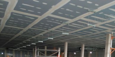 Office mezzanine floor fire protection comprising a  taped and jointed MF ceiling in Essex.