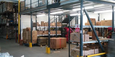 A storage mezzanine floor above a despatch area  for storage of packaging in London.