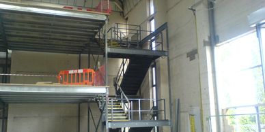 Two storey fire escape staircase structure for office mezzanine floors near Heathrow.