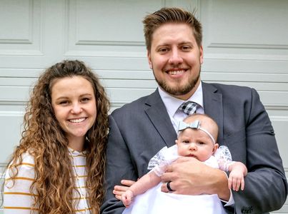 People standing in front of a garage door.