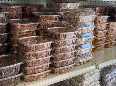 Food market with shelves stocked with fruits and nuts