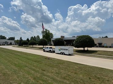 Truck and trailer on a commercial Property for Weekly Maintenance.