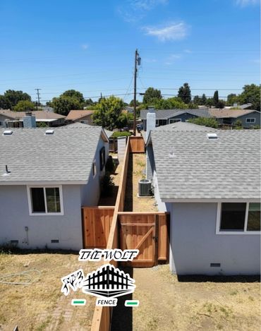 Custom Redwood fence installation in San Jose by The Wolf Fence.
