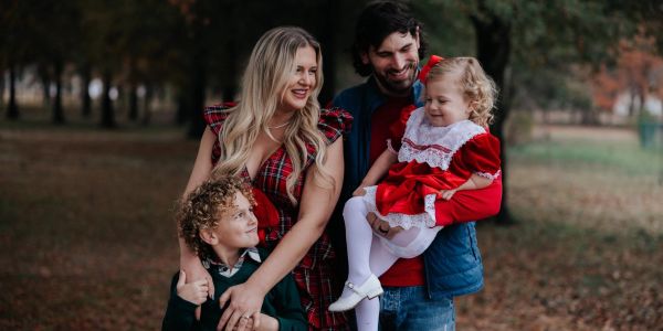 Happy family enjoying time outdoors in fall.