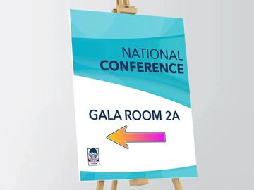 Signboard directing to National Conference in Gala Room 2A with a colorful left arrow.