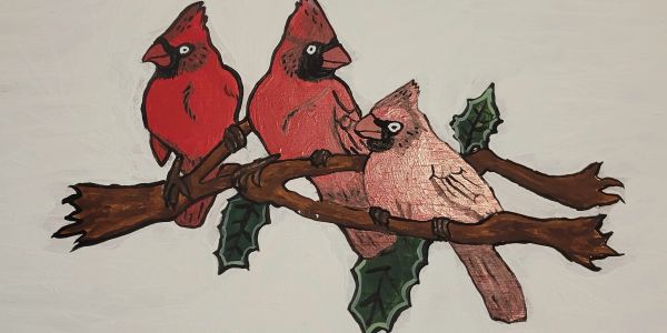 Illustration of three cardinals on holly branches.