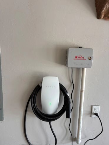 Installed a Tesla Wall Connector for convenient home charging of an electric vehicle.