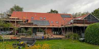 Roof replacement in Beccles, new clay pans, integrated solar panels and roof windows