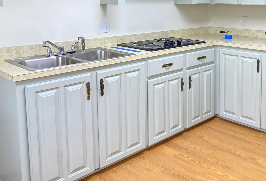 After kitchen cabinet painting in Houma LA – sanded, primed and painted by Bayou Best Painting
