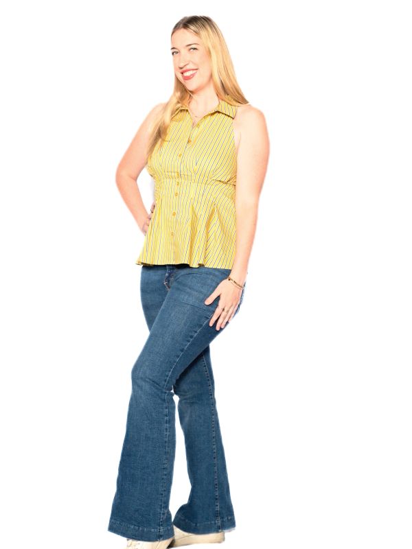Smiling woman in yellow striped top and blue jeans.