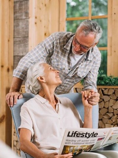 A senior couple holding hands looking at each other representing reverse mortgages, mortgage.