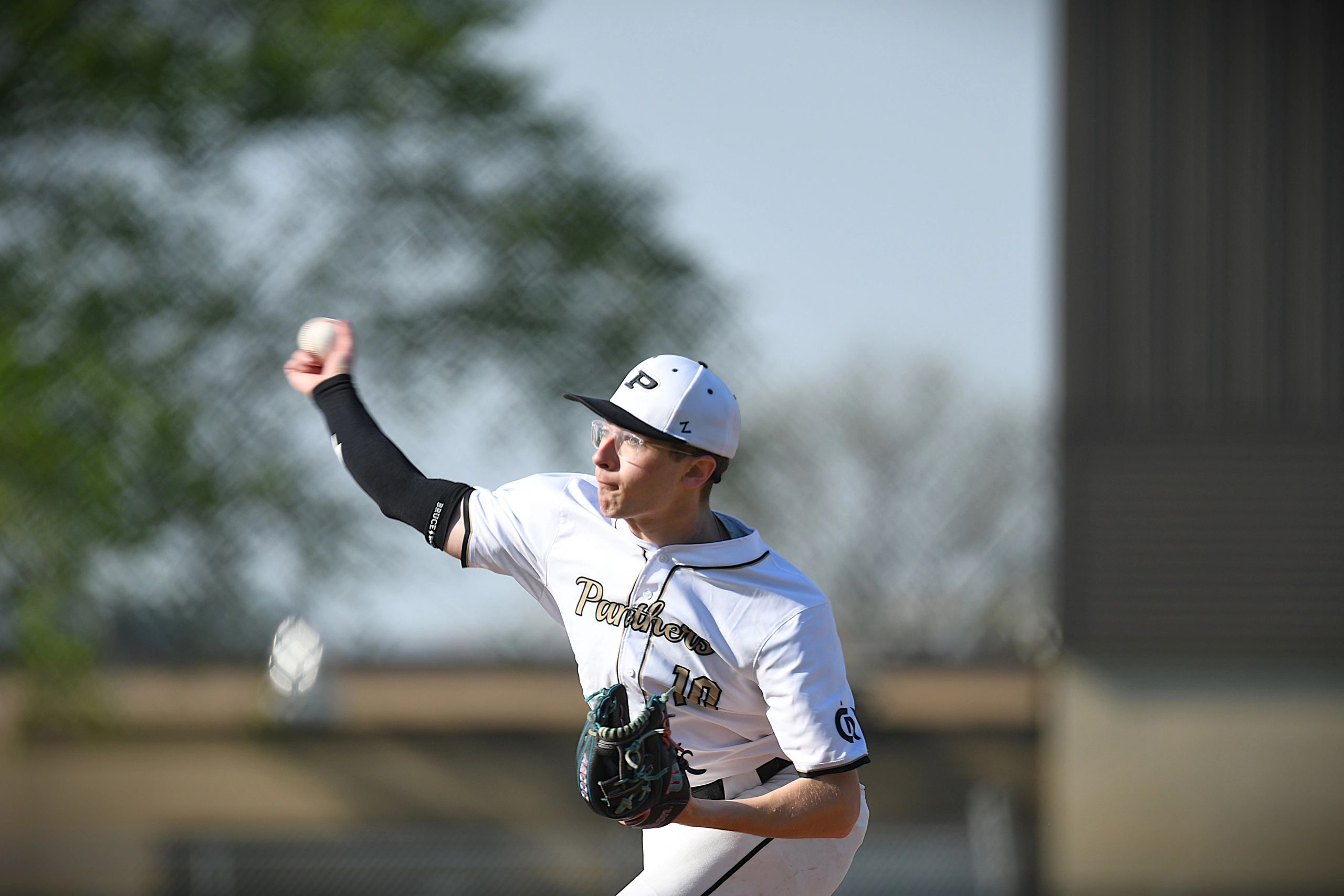 Baseball pitcher in action throwing the ball during a game.