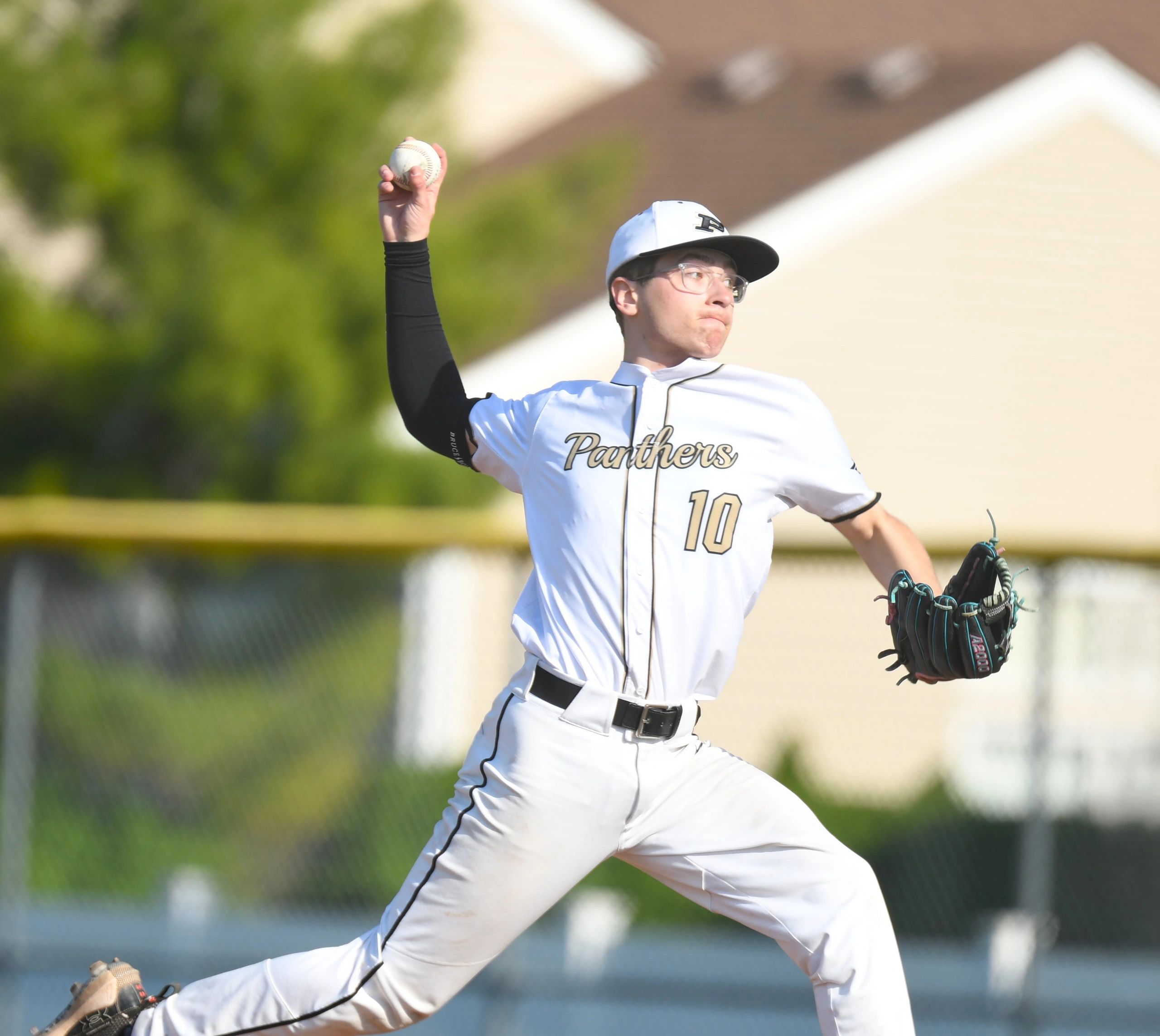 Baseball pitcher in action wearing a Panthers jersey.