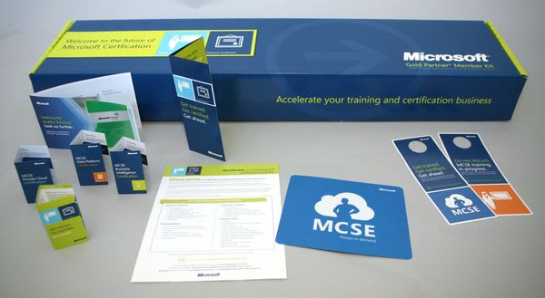 Microsoft MCSE certification training kit with booklets and materials.