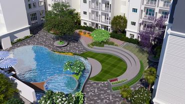Modern apartment complex with a landscaped courtyard and swimming pool.