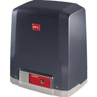 Black and gray BFT sliding gate motor with a red keyhole area.