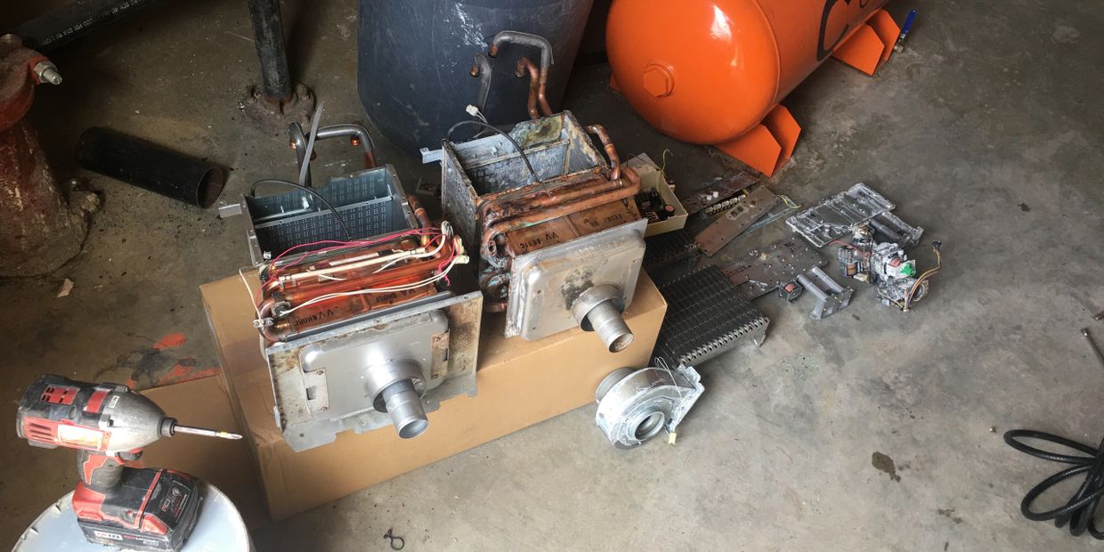 Commercial tankless heater repair. Replaced heat exchanger and burner.
