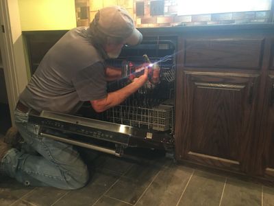 Dishwasher installation with repiping under kitchen sink drainage