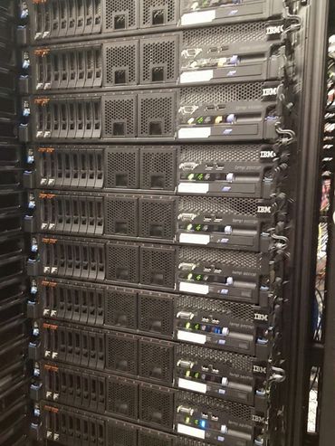 Reliable and scalable IT infrastructure featuring a rack of IBM servers.