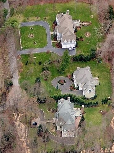 Aerial view of a house with a large yard.