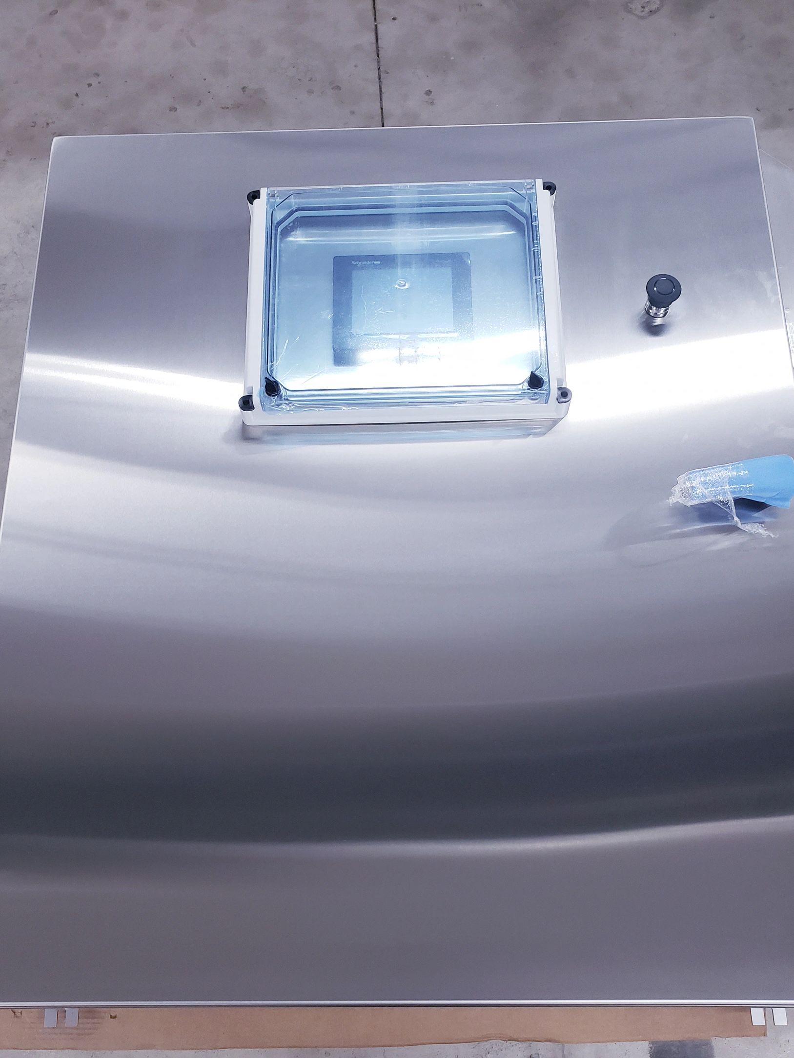 Wash system control panel showing stainless steel enclosure with touchscreen cover.