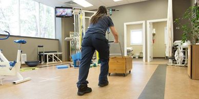 Job candidate pushing a sled full of weights to evaluate strength