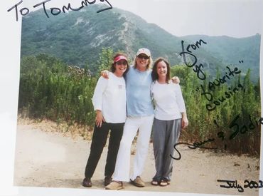Inscribed photograph of Sadie Darnell, Tom Petty and Norma Darnell in Malibu, Calif., July 2003