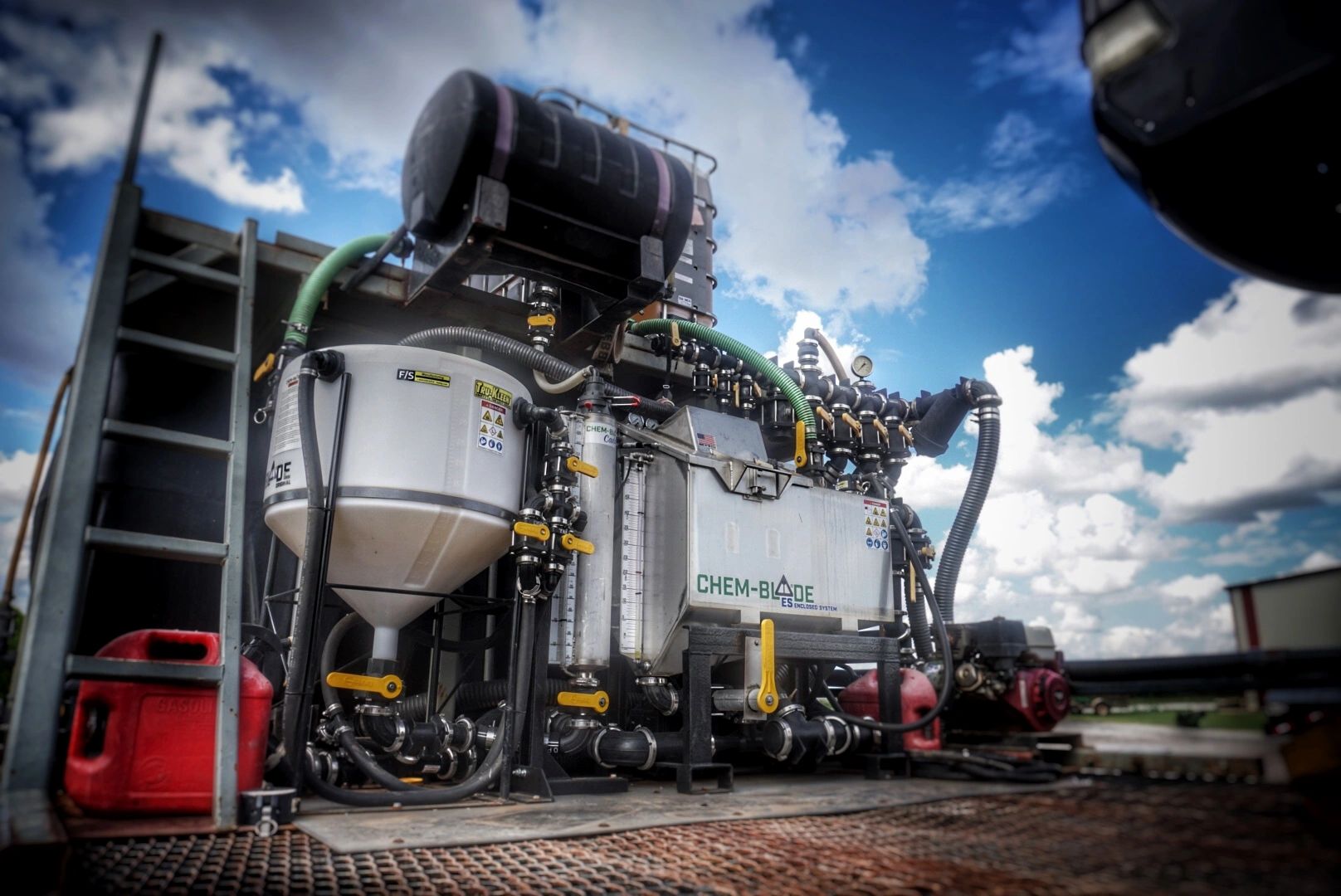 Photo of multiple Chem-Blade products on tender trailer. Chem-Blade Original, Caddy and ES. 